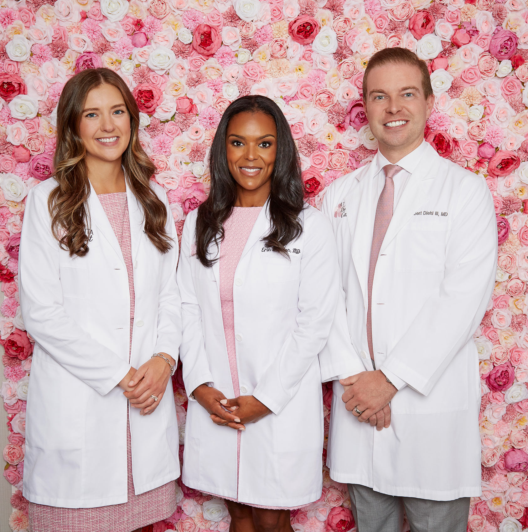 Doctors standing in front of wall